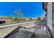 Relaxing outdoor patio area featuring stone accents and comfortable seating at 689 Moonstone Beach Pl, Henderson, NV 89011