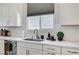 Kitchen counter with stainless steel sink and chrome faucet at 689 Moonstone Beach Pl, Henderson, NV 89011