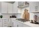 Close up of the kitchen with gas cooktop and white subway tile at 689 Moonstone Beach Pl, Henderson, NV 89011