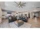 Open-concept living area with comfortable seating, modern furnishings, and a seamless flow to the kitchen at 689 Moonstone Beach Pl, Henderson, NV 89011