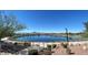 Picturesque pond view with walking paths and well-maintained landscaping on a sunny day at 689 Moonstone Beach Pl, Henderson, NV 89011