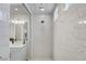 Beautifully tiled shower with rainfall showerhead and modern design at 689 Moonstone Beach Pl, Henderson, NV 89011