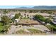 Expansive aerial view showcasing a home with a pool, mature landscaping, and mountain views at 7350 W Rome Blvd, Las Vegas, NV 89131