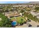 Aerial shot of a property featuring a pool, well-manicured lawn, and outbuildings at 7350 W Rome Blvd, Las Vegas, NV 89131
