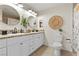 Bright bathroom with double sinks, granite countertops, white cabinets, and stylish decor at 7350 W Rome Blvd, Las Vegas, NV 89131