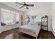 Bright bedroom featuring a window seat and dark wood floors at 7350 W Rome Blvd, Las Vegas, NV 89131