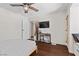 Bedroom with dark wood floors, and a built-in nook and desk at 7350 W Rome Blvd, Las Vegas, NV 89131