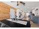 Inviting dining area featuring wood accent wall, modern decor, and seamless transition to the updated kitchen at 7350 W Rome Blvd, Las Vegas, NV 89131