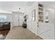Inviting entryway with decorative shelving, a stylish light fixture and tiled flooring at 7350 W Rome Blvd, Las Vegas, NV 89131