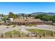 Charming single-story home with mature landscaping, manicured lawns, and a welcoming entrance at 7350 W Rome Blvd, Las Vegas, NV 89131