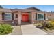 Welcoming front entrance with double doors, brick accents, manicured landscaping and walkway at 7350 W Rome Blvd, Las Vegas, NV 89131