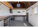 Inside a workshop, featuring a workbench, storage, and natural light at 7350 W Rome Blvd, Las Vegas, NV 89131