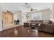 Spacious living room with wood floors, natural light, and seamless flow, perfect for comfortable living and entertaining at 7350 W Rome Blvd, Las Vegas, NV 89131