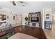 Inviting living room with stylish decor, a large TV, and seamless flow into other areas of the home at 7350 W Rome Blvd, Las Vegas, NV 89131