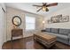 Cozy living room with rustic wood accent wall, modern gray sofa, and industrial-style coffee table at 7350 W Rome Blvd, Las Vegas, NV 89131