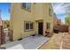 This backyard features a small patio, a grill, and an air conditioning unit at 7361 Ringquist St, Las Vegas, NV 89148