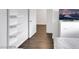 Bedroom with floating shelving and tv at 7361 Ringquist St, Las Vegas, NV 89148