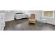 This cozy bedroom showcases laminate floors, soft natural light, and an accent chair at 7361 Ringquist St, Las Vegas, NV 89148
