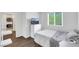 Comfortable bedroom featuring a window, modern furniture, and an adjacent closet at 7361 Ringquist St, Las Vegas, NV 89148