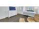 Bright bedroom featuring a white dresser, an accent chair, and natural light at 7361 Ringquist St, Las Vegas, NV 89148