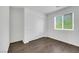 Bright bedroom features a window providing natural light and ample closet space with laminate floors at 7361 Ringquist St, Las Vegas, NV 89148