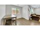 Adjacent to living room is cozy nook with modern table, comfortable seating, and great view at 7361 Ringquist St, Las Vegas, NV 89148