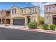 Inviting two-story home with a spacious two-car garage and desert landscaping in a modern community at 7361 Ringquist St, Las Vegas, NV 89148