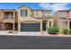Charming two-story home features a two-car garage and low maintenance landscaping at 7361 Ringquist St, Las Vegas, NV 89148