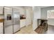 Kitchen featuring stainless steel refrigerator and adjacent breakfast nook at 7361 Ringquist St, Las Vegas, NV 89148