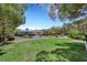 Enjoy the community playground with swings and a slide on lush green grass at 7361 Ringquist St, Las Vegas, NV 89148