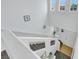 Bright staircase with clerestory windows and glass panel railings at 7361 Ringquist St, Las Vegas, NV 89148
