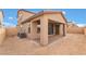 Spacious backyard featuring a covered patio, with brickwork, providing an ideal spot for outdoor relaxation and entertainment at 789 Black Palace St, Henderson, NV 89011