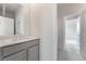 Bathroom with a modern vanity, stylish fixtures, and access to another room at 789 Black Palace St, Henderson, NV 89011
