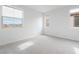 Bright bedroom featuring plush carpeting, fresh paint, and natural light from multiple windows at 789 Black Palace St, Henderson, NV 89011