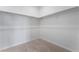 Walk-in closet featuring carpeted floor and clothing rods for ample storage at 789 Black Palace St, Henderson, NV 89011