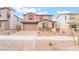 Charming two-story home with a two-car garage and desert landscaping in a residential neighborhood at 789 Black Palace St, Henderson, NV 89011