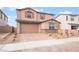 Charming two-story home with a two-car garage and desert landscaping in a residential neighborhood at 789 Black Palace St, Henderson, NV 89011
