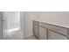 Hallway with tiled floors featuring a modern vanity and plenty of storage at 789 Black Palace St, Henderson, NV 89011