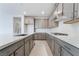 This kitchen offers a spacious quartz countertop, stainless appliances, and gray cabinetry at 789 Black Palace St, Henderson, NV 89011