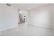 Expansive empty living room with tile flooring, recessed lighting, and access to the staircase at 789 Black Palace St, Henderson, NV 89011