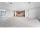 Expansive living space showcases an open layout to kitchen with neutral tile flooring at 789 Black Palace St, Henderson, NV 89011