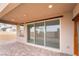 Covered patio with brick flooring, recessed lighting, and large sliding glass doors for seamless indoor-outdoor living at 789 Black Palace St, Henderson, NV 89011