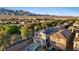 A beautiful neighborhood is set against the backdrop of rugged mountains and a clear blue sky at 8566 Burning Bridge Ct, Las Vegas, NV 89131