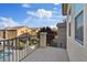 Balcony overlooking neighborhood with stone and iron rail at 8566 Burning Bridge Ct, Las Vegas, NV 89131
