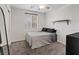 This bedroom is cozy and minimalist, with a mirror and black shelving at 8566 Burning Bridge Ct, Las Vegas, NV 89131