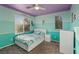 Stylish bedroom with blue and green walls, carpet flooring and natural light at 8566 Burning Bridge Ct, Las Vegas, NV 89131