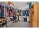 Spacious walk-in closet features built-in shelving and ample storage for clothes, shoes and accessories at 8566 Burning Bridge Ct, Las Vegas, NV 89131