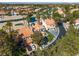 Stunning aerial view highlighting luxury desert home near a pond, golf course and mature trees at 8848 Rainbow Ridge Dr, Las Vegas, NV 89117