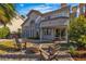Spacious backyard with seating, fire pit, and charming exterior at 8848 Rainbow Ridge Dr, Las Vegas, NV 89117