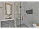Walk-in shower features marble walls, chevron flooring, and luxurious gold fixtures and hardware at 8848 Rainbow Ridge Dr, Las Vegas, NV 89117